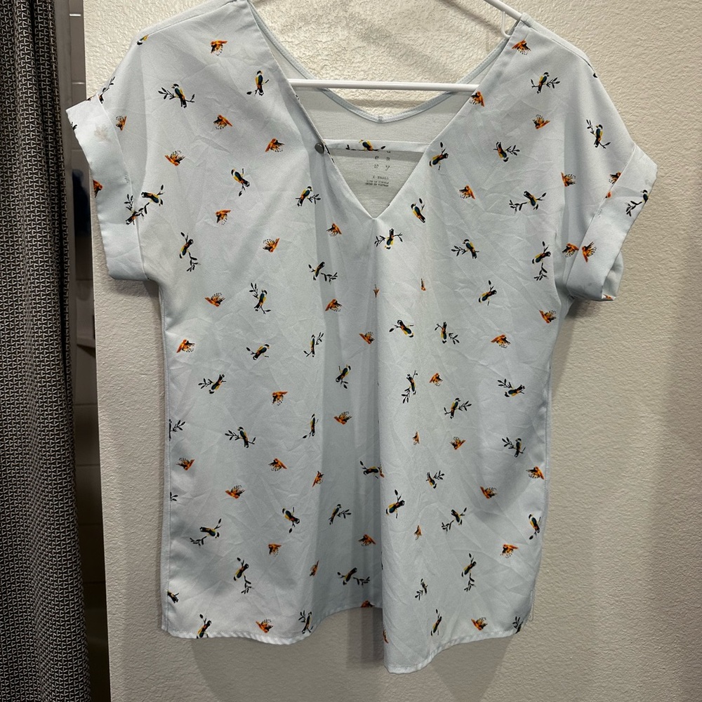 Baby blue short sleeve blouse with bird pattern